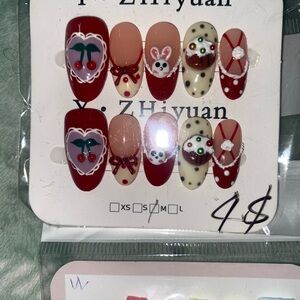 Festive Nail Art Set with Red and Cream Designs